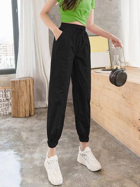 Női alkalmi nadrág magas derékkal és megkötővel