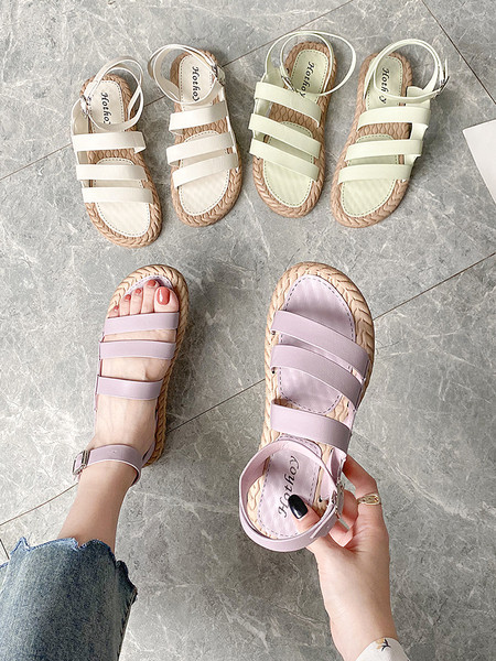 Műbőrből készült alkalmi női szandál lapos talppal és csattal