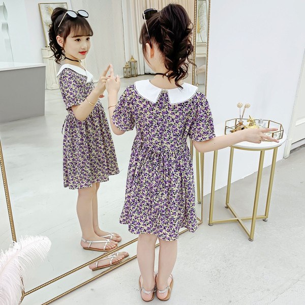 Gyerekruha virágmintával és spitz nyakkivágással