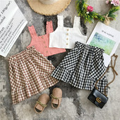 Mūsdienīgs bērnu komplekts no divām daļām, rūtainiem svārkiem
