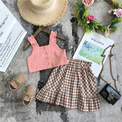 Mūsdienīgs bērnu komplekts no divām daļām, rūtainiem svārkiem