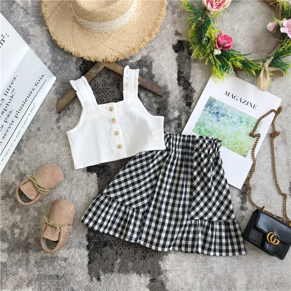 Mūsdienīgs bērnu komplekts no divām daļām, rūtainiem svārkiem