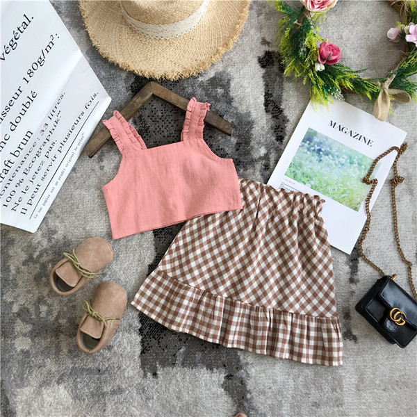 Mūsdienīgs bērnu komplekts no divām daļām, rūtainiem svārkiem