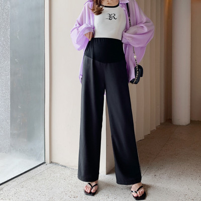 Alkalmi nadrág terhes nők számára széles modell szegéllyel