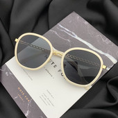 Stílusos női napszemüveg kerek formában, vékony kerettel