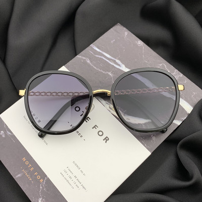 Stílusos női napszemüveg kerek formában, vékony kerettel