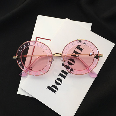 Γυναικεία στρογγυλά γυαλιά ηλίου με επιγραφές