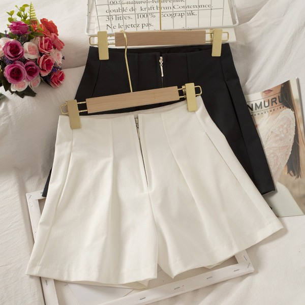 Női széles nadrág cipzárral és magas derékkal