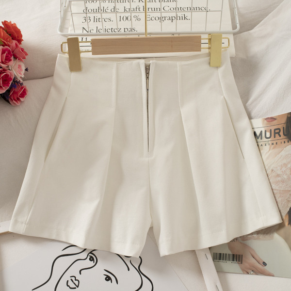 Női széles nadrág cipzárral és magas derékkal