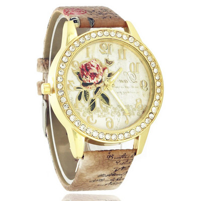 Női karóra nyomatokkal és kövekkel