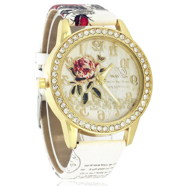 Női karóra nyomatokkal és kövekkel