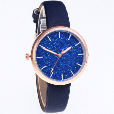 Modern női karóra bőr szíjjal és fényes részecskékkel