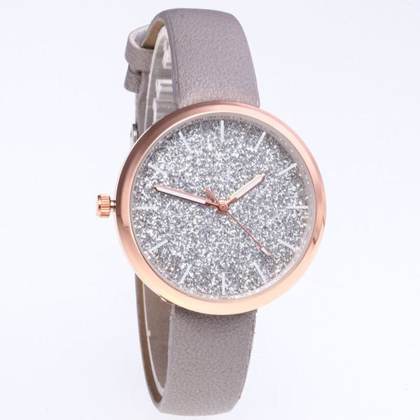 Modern női karóra bőr szíjjal és fényes részecskékkel