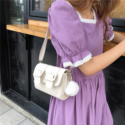 Ženska mini torbica s dugom ručkom