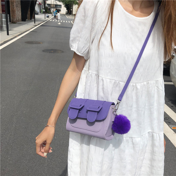 Ženska mini torbica s dugom ručkom