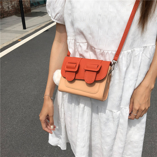 Ženska mini torbica s dugom ručkom