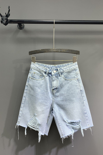 Női farmer szakadt motívumokkal, kék színben