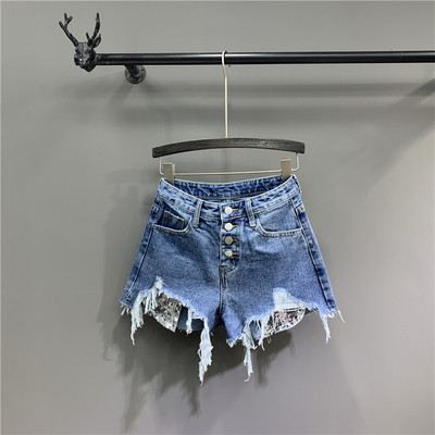Модерни къси дамски панталони със скъсани елементи в син цвят