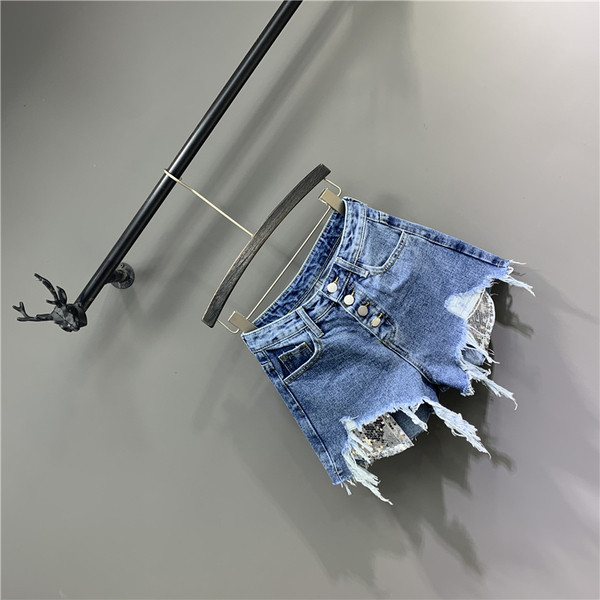 Moodsad sinist värvi rebenenud elementidega naiste lühikesed püksid