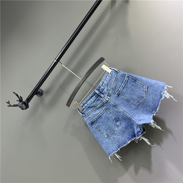 Moodsad sinist värvi rebenenud elementidega naiste lühikesed püksid