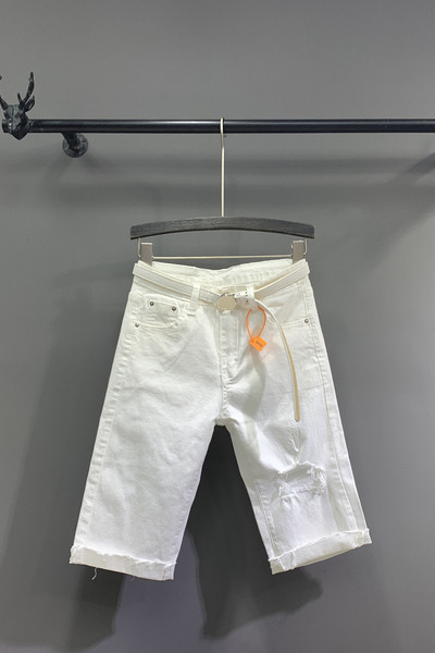 Új modell 3/4-es női nadrág övvel, szakadt motívumokkal