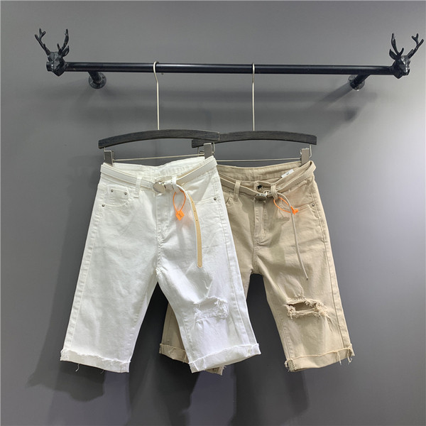 Új modell 3/4-es női nadrág övvel, szakadt motívumokkal