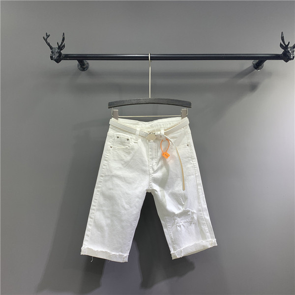 Új modell 3/4-es női nadrág övvel, szakadt motívumokkal