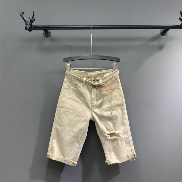 Új modell 3/4-es női nadrág övvel, szakadt motívumokkal