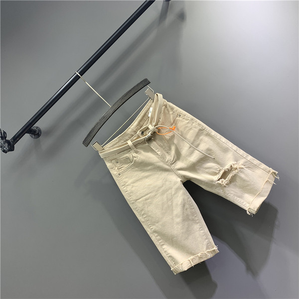 Új modell 3/4-es női nadrág övvel, szakadt motívumokkal