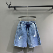 Lezser női 3/4-es nadrág szakadt motívumokkal, kék színben