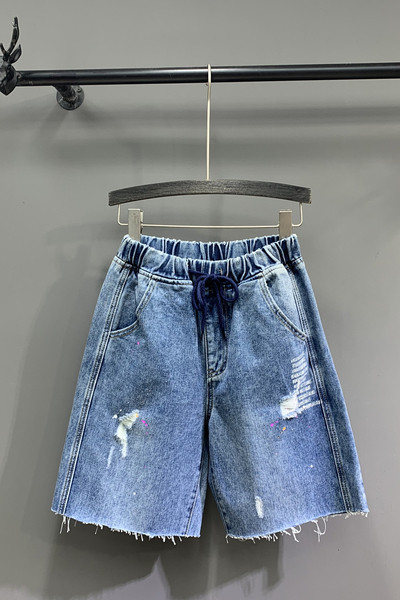 Lezser női 3/4-es nadrág szakadt motívumokkal, kék színben