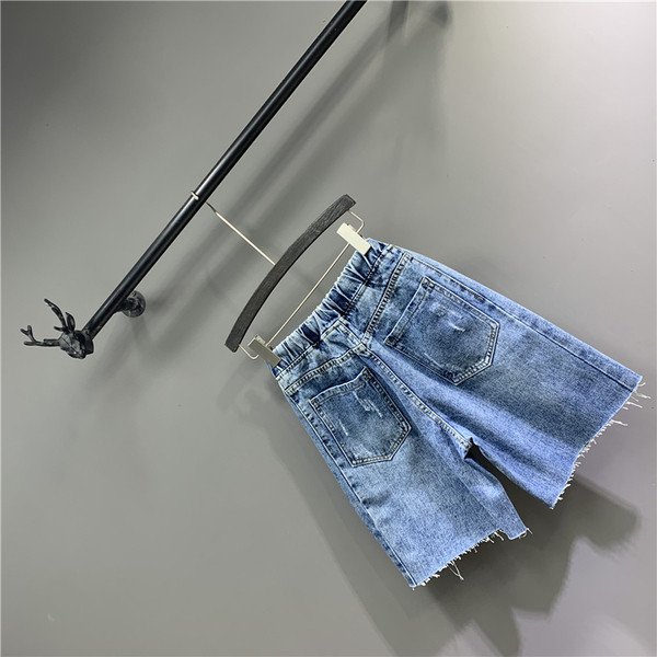 Lezser női 3/4-es nadrág szakadt motívumokkal, kék színben