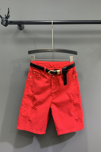 Női alkalmi nadrág övvel, szakadt motívumokkal