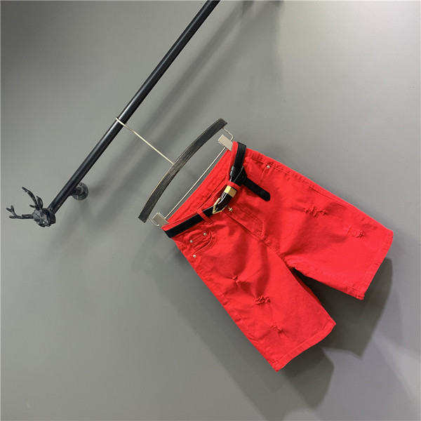 Női alkalmi nadrág övvel, szakadt motívumokkal