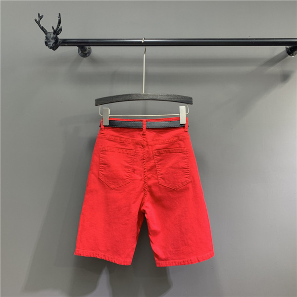 Női alkalmi nadrág övvel, szakadt motívumokkal