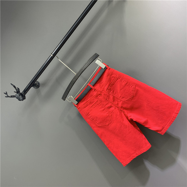 Női alkalmi nadrág övvel, szakadt motívumokkal