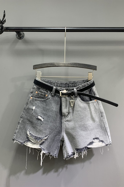 Női farmer rövidnadrág szakadt motívumokkal és övvel