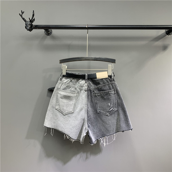 Női farmer rövidnadrág szakadt motívumokkal és övvel