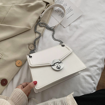 Eko bőrből készült stílusos női táska, hosszú fém fogantyúval