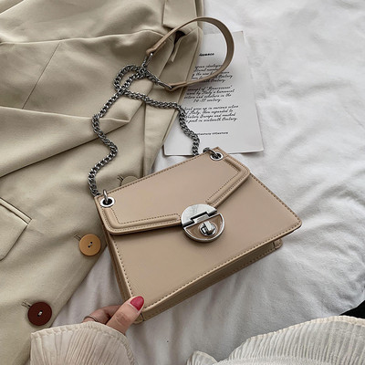 Eko bőrből készült stílusos női táska, hosszú fém fogantyúval