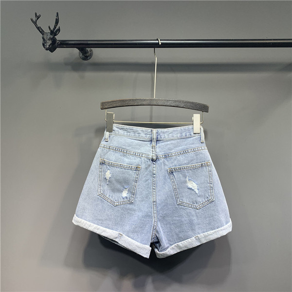 Modern női farmer szakadt motívumokkal