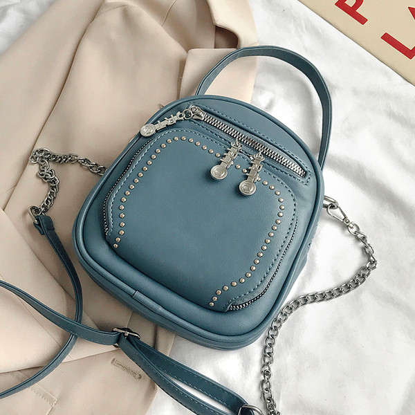 Modern női táska eko bőrből, cipzárral és kiegészítővel