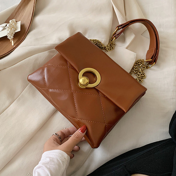 Öko-nahast ja metallist kinnitusega moodne naistekott