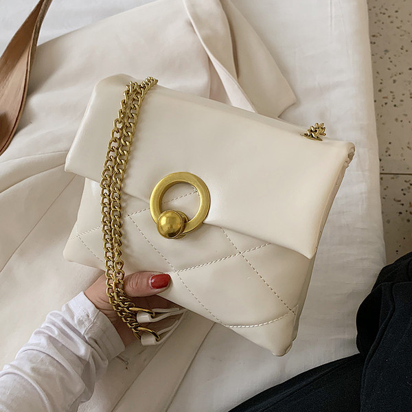 Öko-nahast ja metallist kinnitusega moodne naistekott