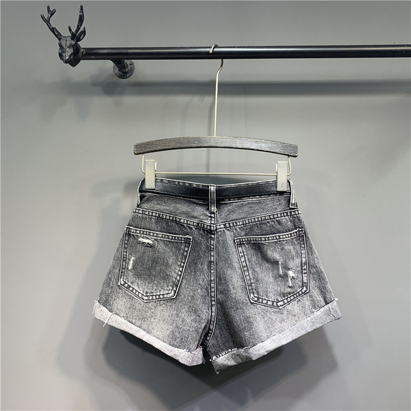 Modern női nadrág szakadt elemekkel - retro stílusú