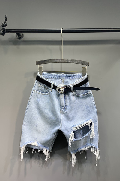 Új női farmer modell szakadt elemekkel és övvel