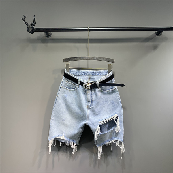 Új női farmer modell szakadt elemekkel és övvel