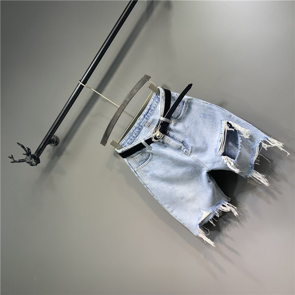 Új női farmer modell szakadt elemekkel és övvel