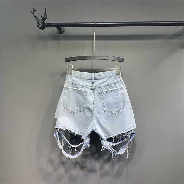 Modern rövidnadrág szakadt motívumokkal - kék színű