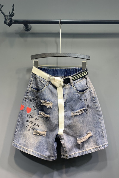 Aplikatsioonide ja rebenenud motiividega vabaaja naiste teksad